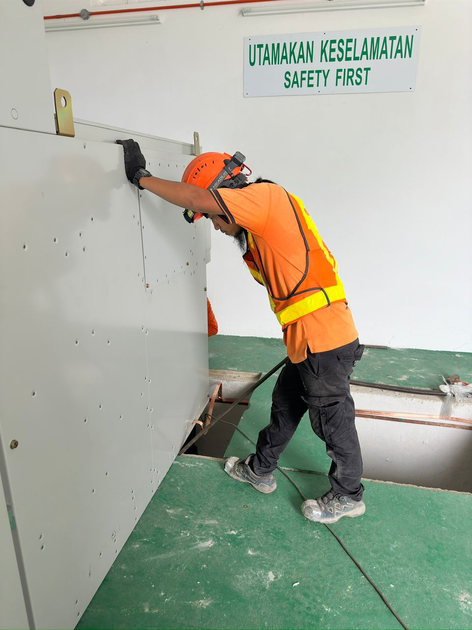 NIKKISO-AYSHA technician installing a substation panel under safety-first procedures in Penang